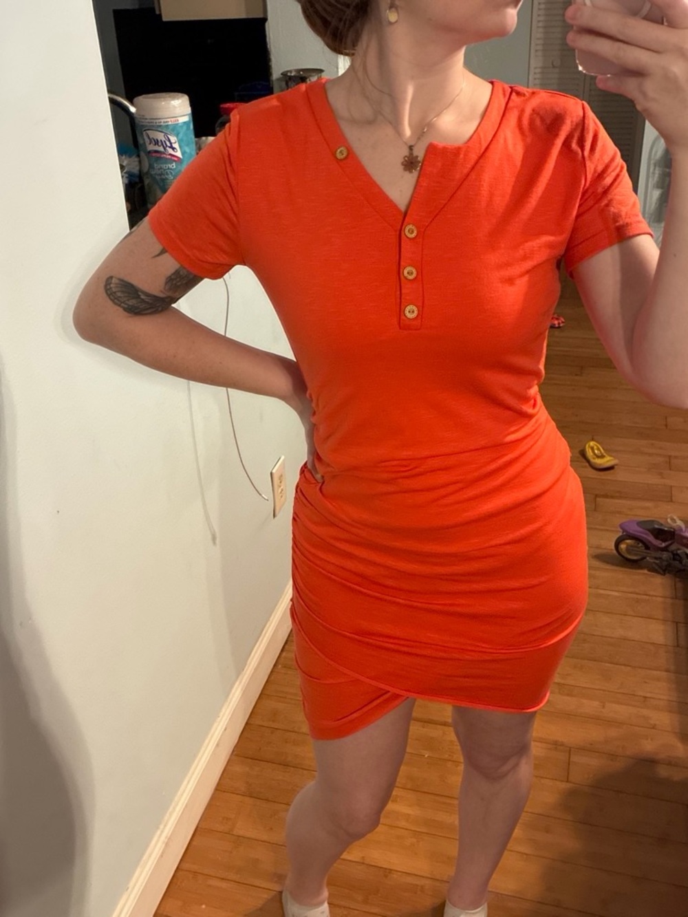 Orange midi dress with a cute ruched detail